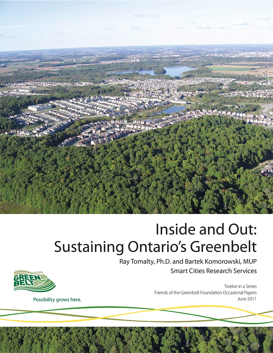 Report cover featuring Aerial photograph of suburban housing beside large forested areas and ponds.
