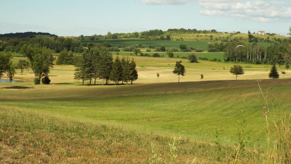 Rolling hills of the oak ridges moraine, with trees in the distance