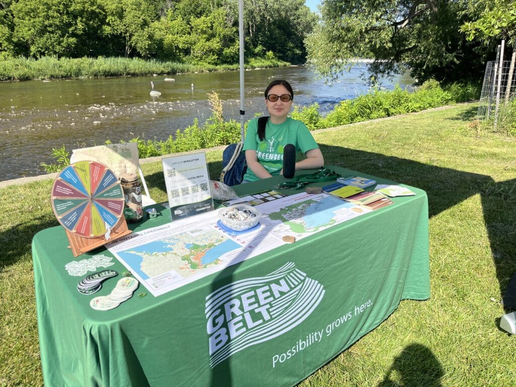 Person at outdoor informational booth